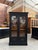 This antique display cabinet made of walnut and oak has been fully restored. It features a black-patinated cabinet body,...