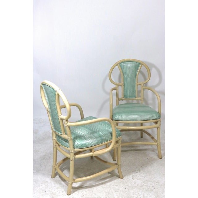 Mid Century Modern pair of sophisticated stylish bone lacquered rattan Willow and Reed Armchairs with labels, designed by...