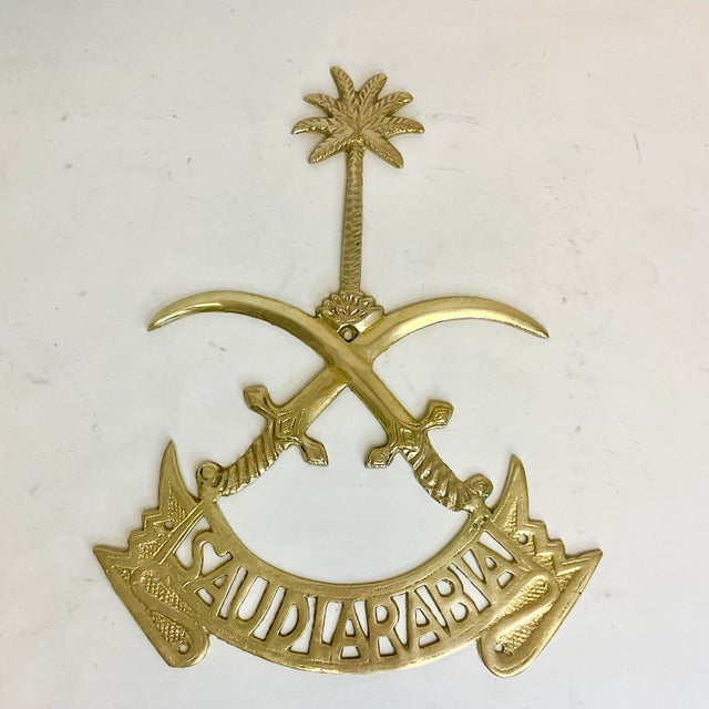In 1950, Saudi Arabia adopted a National Emblem consisting of two crossed swords with a Palm Tree above the cross. This is...