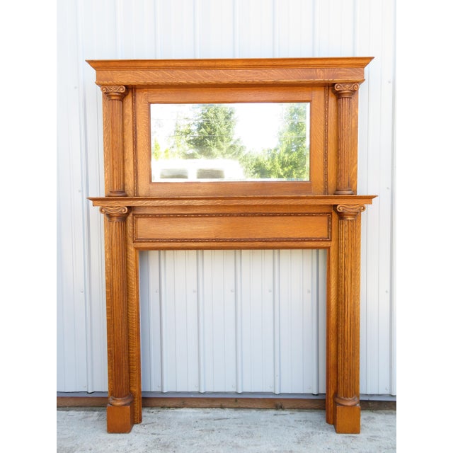 Antique quartersawn oak fireplace mantel surround with matching mirror top piece. Circa early 1900's. This piece is in...