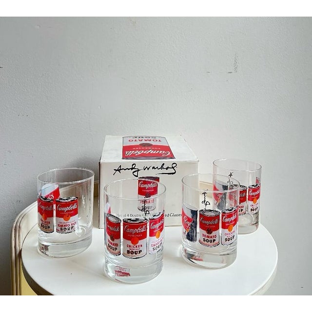 Set of four glasses from the Campbell's Andy Warhol Series produced by Block Collectible set of four clear glass glasses...