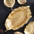 A handcarved clay mold is what creates the natural leaf details. Made of aluminum, this substantial tray is then finished...