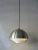 This mid-century pendant light was manufactured in Denmark in the 1960s. Made from brass and metal, the main body of the...