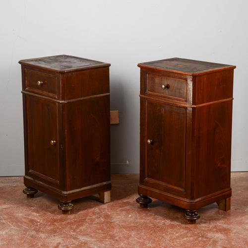 This elegant pair of solid wood nightstands dates back to the late 19th century, a period that favored furnishings with a...