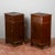 This elegant pair of solid wood nightstands dates back to the late 19th century, a period that favored furnishings with a...