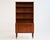 Teak frame with open bookcase, three drawers, and a pull-out desk. Dansk Møbelfabrik, 1960s. Danish teak bookcase from the...