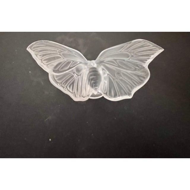 Lalique frosted/satin crystal bird figurine (glass/crystal). Sculptural form with raised wing and extended tail, as shown.