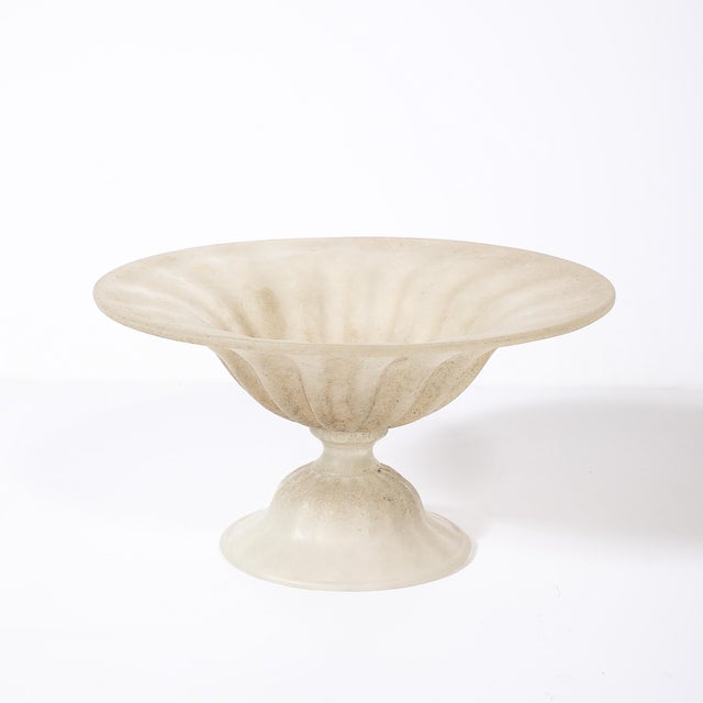 This Mid-Century Modernist Scavo glass centerpiece bowl, crafted in Murano, Italy, circa 1980, is a brilliant example of...