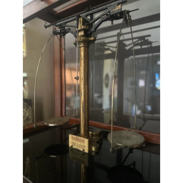 A remarkable piece of early 20th-century laboratory craftsmanship by Eimer & Amend of New York, this analytical balance...