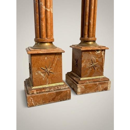 Bring classic sophistication to your home with this striking pair of neoclassical-style veined marble columns. Each column...
