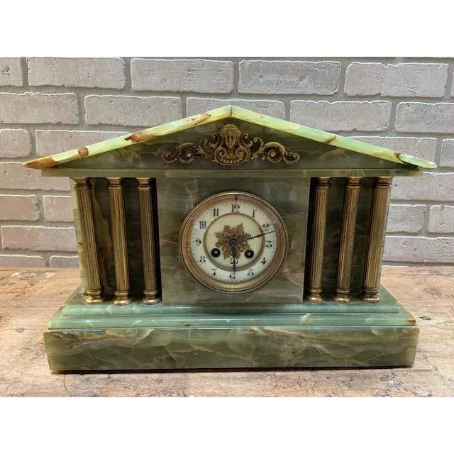 Antique French Neoclassical Green Onyx Garniture Clock Set Antique French three-piece garniture set featuring a...