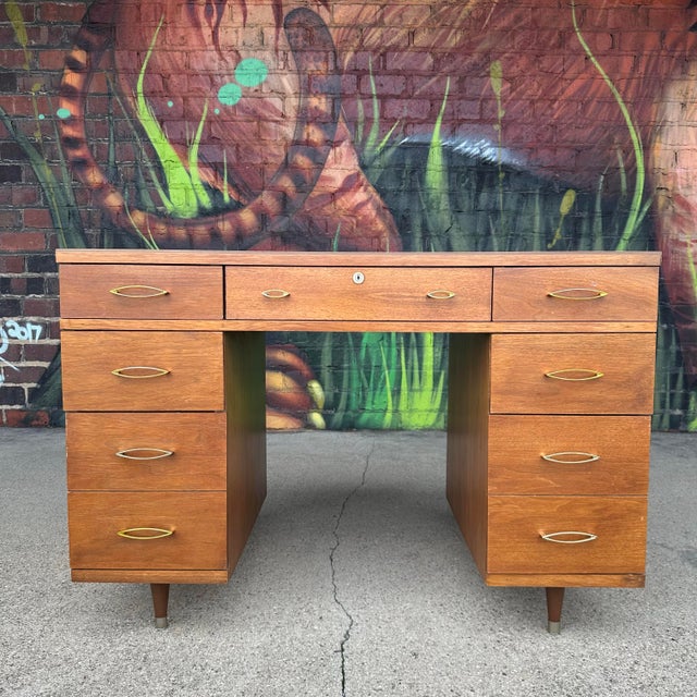 7-drawer desk by Heywood Wakefield for their Contessa line. This piece features brass drawers pulls and plenty of room for...