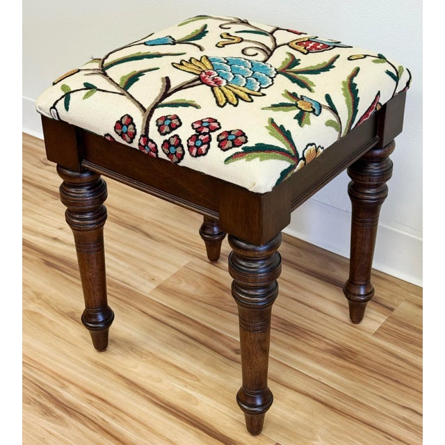Very sturdy vintage Bombay Company turned wood stool. Newly upholstered in a stunning vibrant embroidered floral...