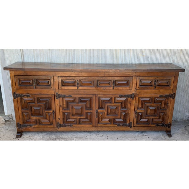 From Northern Spain, constructed of solid oak, the rectangular top with molded edge atop a conforming case housing three...