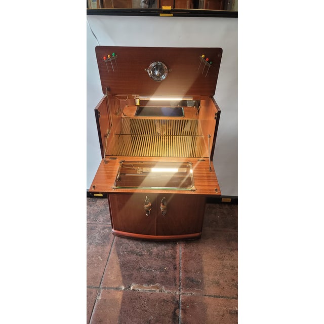 A wonderful Art Deco Cocktail Bar ,in very nice condition. The light has been updated and everything in working order....
