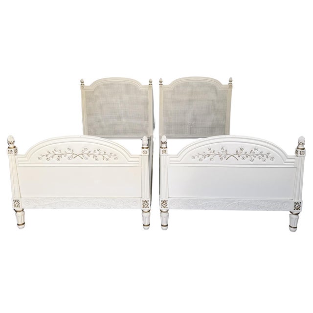 Beautiful pair of mid-century American-made French Provincial / Louis XVI twin beds finished in a distressed Creme Peinte...