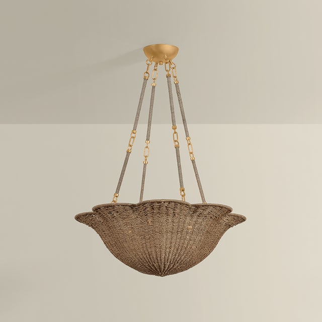 The Ardonia family pairs two trending design elements, scallops and naturals. Woven tightly from abaca fibers, the upward-...