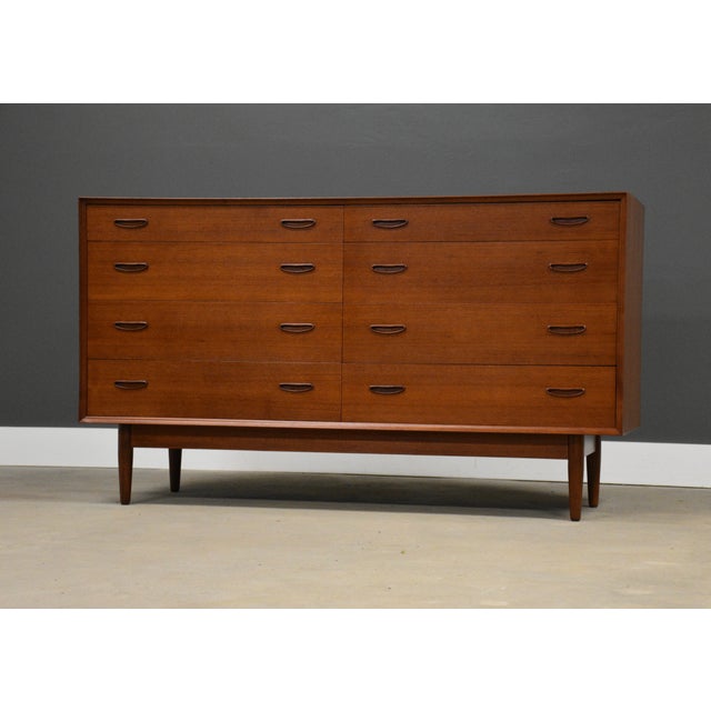 A beautiful mid century modern teak eight drawer dresser designed by Erik Buch. Professionally refinished. Circa 1960’s....