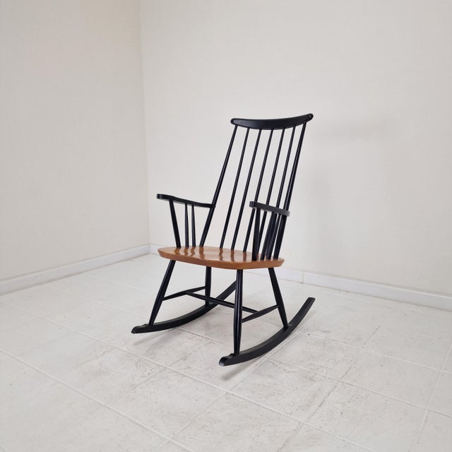 This classic Scandinavian rocking chair showcases Tapiovaara’s well-known approach to functional modern design, combining...