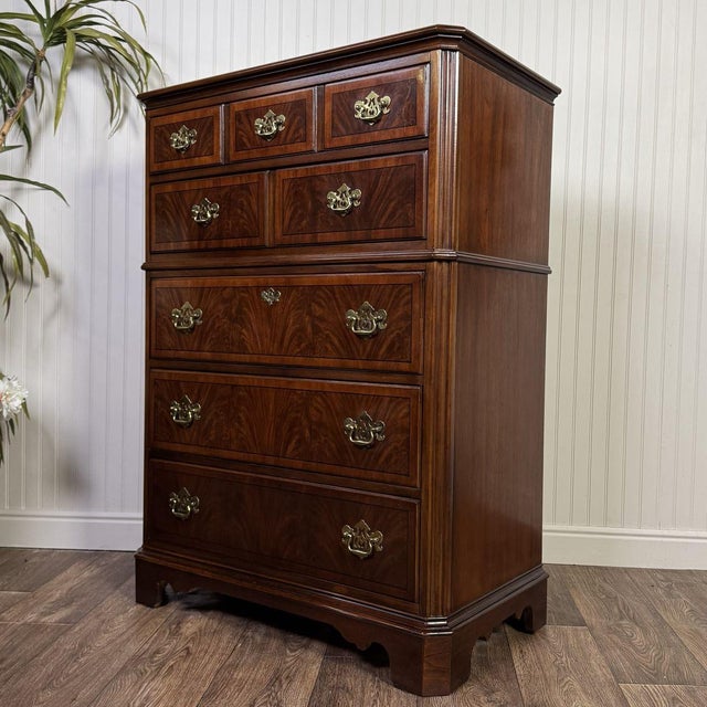 Vintage Drexel Heritage tall chest of drawers from the Chippendale collection, crafted in flame mahogany veneer and...