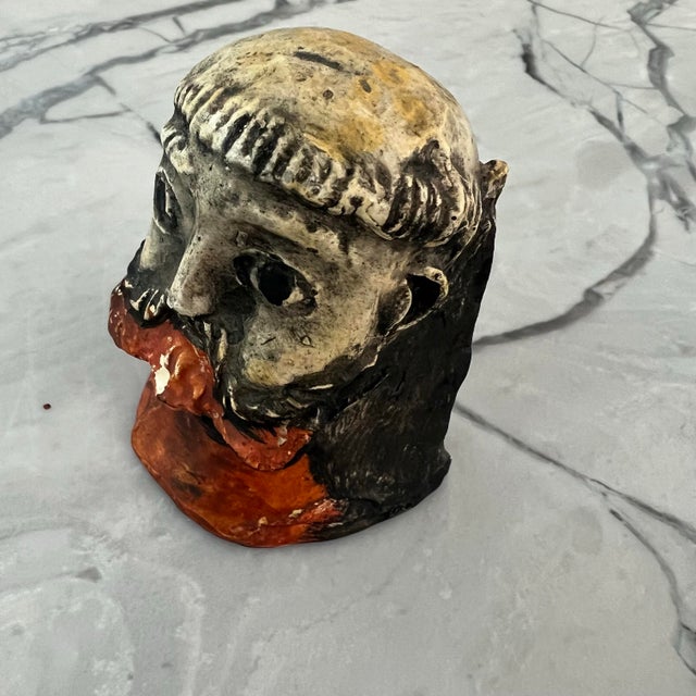Small sculpture of a man’s head hand made. Reminiscent of Picasso’s style or a Guatemalan folk art barbones (bearded man)....