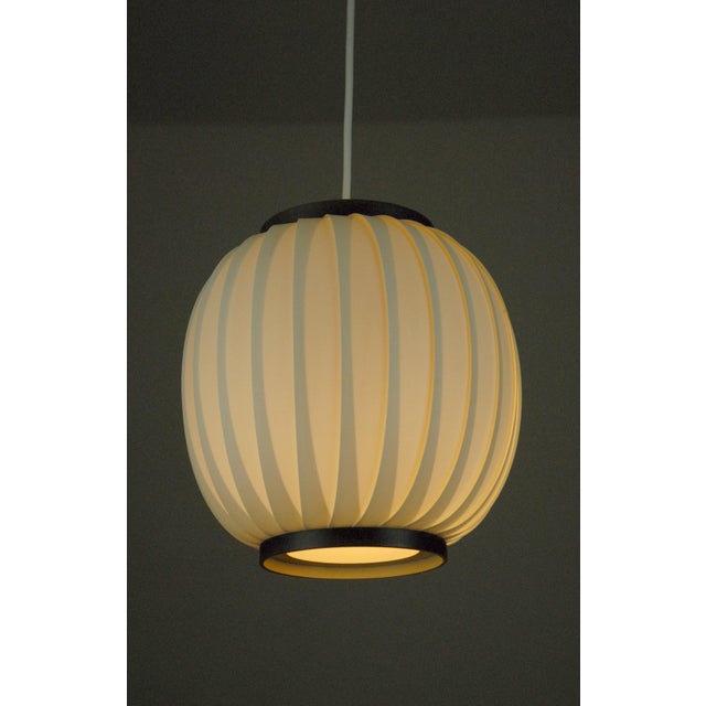 A rare mid-century pendant light designed by svend aage holm sørensen during his influential period in the 1950s. This...