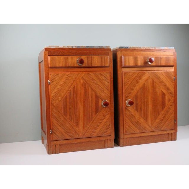 Elegant pair of French Art Deco bedside cabinets dating from the 1930s. Crafted in solid oak with finely executed...