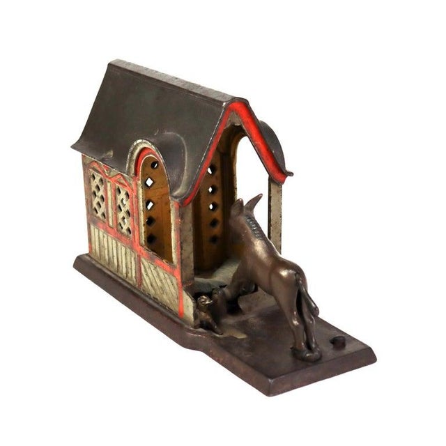 Antique Panted Cast Iron Figural Mule & Barn Mechanical Bank C1880. Measures - 5.25"H x 3.5"W x 8.5"D. This antique cast...