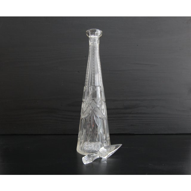 A tapered crystal glass carafe with wedge cut. Probably from the 1960s. The traditional craft of glassblowing and glass...