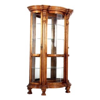 A Pulaski Furniture Company Serpentine Front Oak Curio Cabinet. For Sale