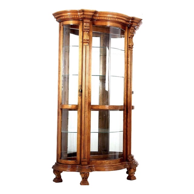 A Pulaski Furniture Company Serpentine Front Oak Curio Cabinet. For Sale