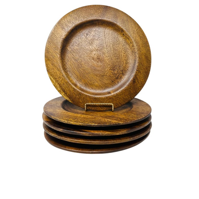 This sophisticated set of five (5) large-scale charger plates is hand-turned from solid blocks of premium acacia wood....