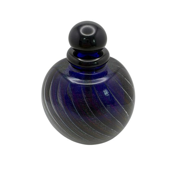 A exquisite dichroic art glass scent bottle and stopper by Robert Eickholt, ca. 1986. The bottle is hand blown in...