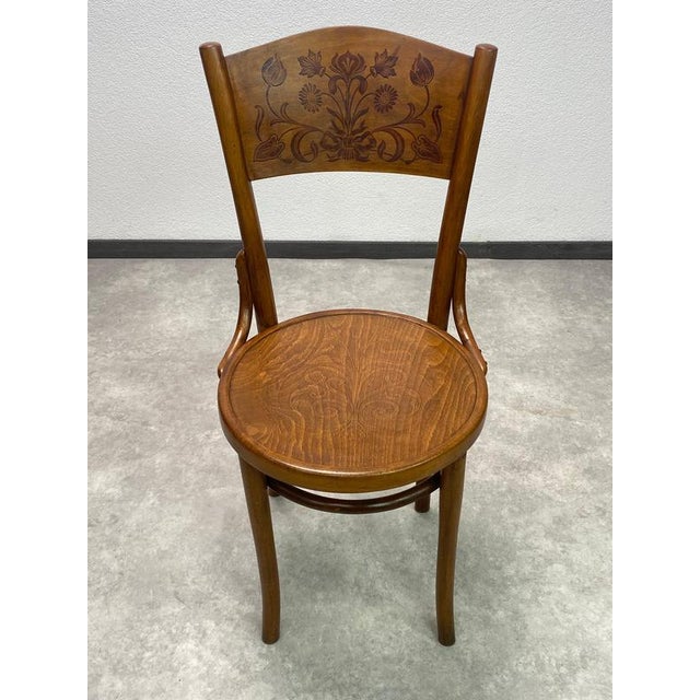 Set of 4 dining room chairs by Thonet Mundus. Professionally stained and repolished. This piece is attributed to the...