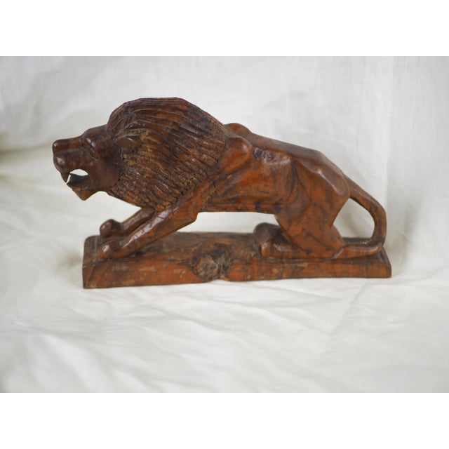 Angular lion statuette in walnut, popular creation but style very inspired by art deco. This statuette is at the same time...