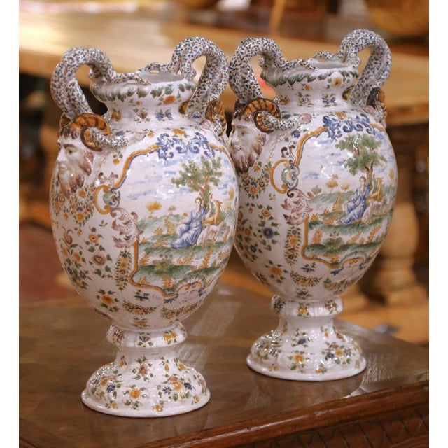 This elegant pair of large antique 19th century Moustiers faience vases, executed circa 1870 in the Neoclassical (Louis...