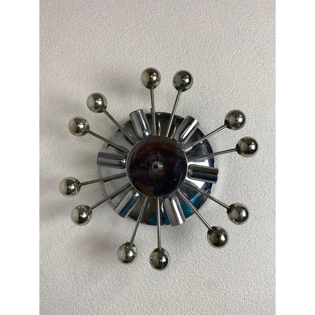 Space age Sputnik wall lamp in original vintage condition with patina. Up to 250V (Europe/UK Standard).The wiring of this...