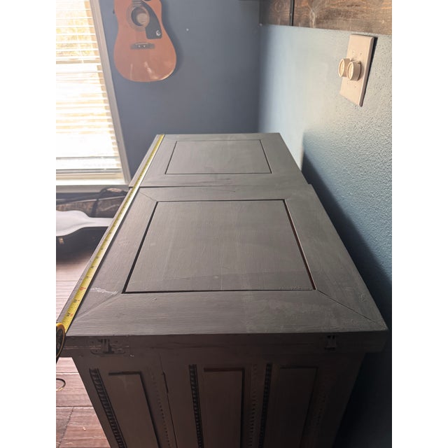 Painted a charcoal/gray finish with an aged/distressed look. The ornate detailing along the bottom and trim gives it a...