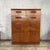 stylish mid-century teak tallboy chest of drawers by British furniture manufacturer Meredew, featuring beautifully figured...