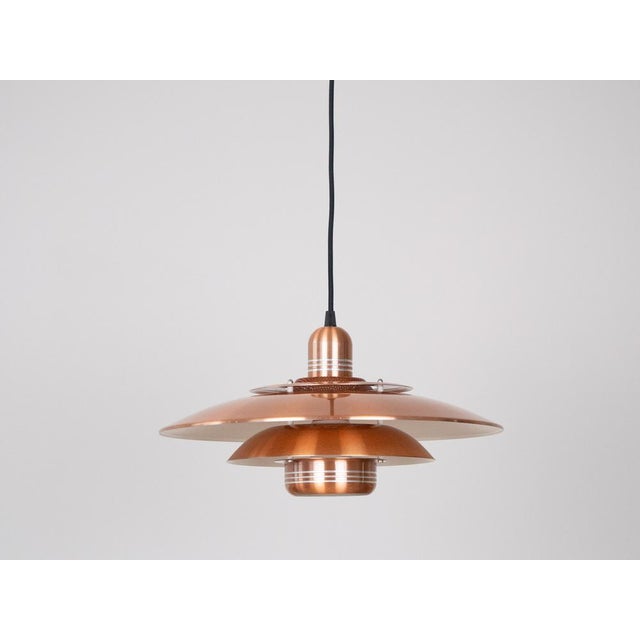 This lamp was designed by Danish designer Kurt Wiborg and manufactured by Jeka. The lamp's form is based on the principle...