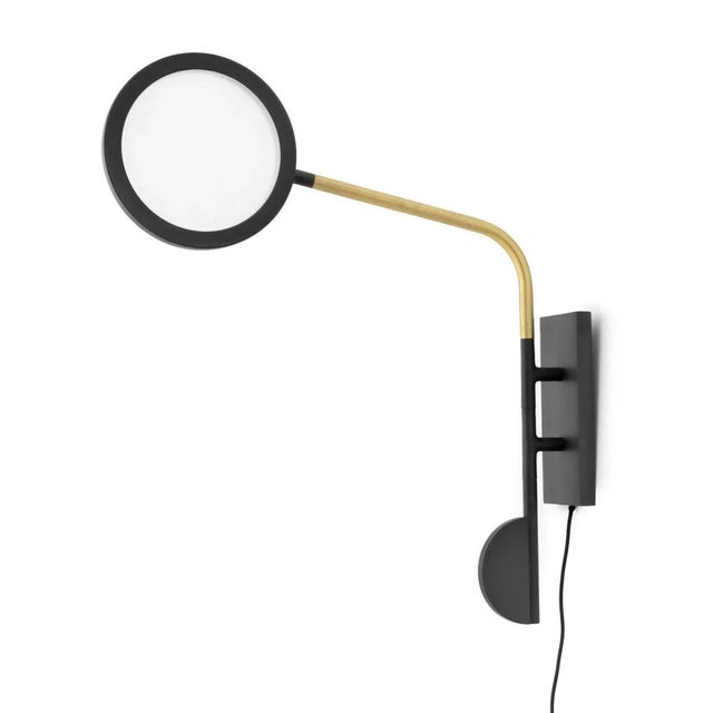 Pair of Discus Adjustable Wall Sconces. Each: 26" H x 9.5" W x 4.25" D. Provenance: From a New York City Collection.