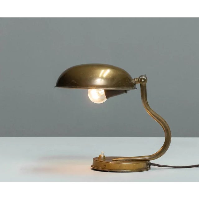 Beautiful and cute little table / desk lamp from the 1940s in brass made by ASEA in Sweden and attributed to designer Hans...