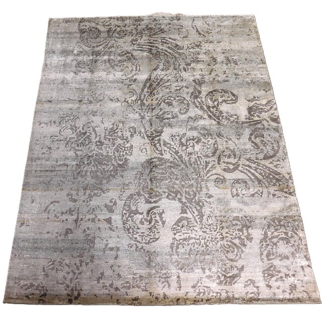 Tone on tome, grey on silver in bamboo silk. Large botanical pattern. Hand knotted to perfection.