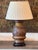 Champleve bronze vase mounted as a table lamp, the baluster body cast in low relief with dense scrollwork and enameled in...