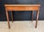 A nice quality Georgian Tea Table, made from Mahogany with Box wood inlays. The back leg gates open and the top flips over...