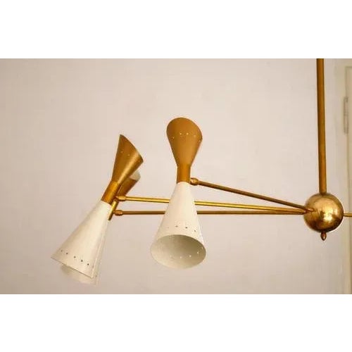 Introducing a captivating and innovative take on mid-century-inspired chandeliers, this design artfully plays with...