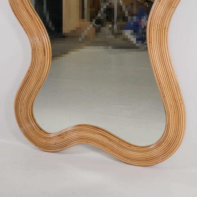 Stunning large rattan mirror in the shape of waves. It can be hung on the wall or placed on the floor; it's a true work of...