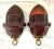 This elegant pair of wall sconces is crafted in richly lacquered burgundy tole, accented with fine hand-painted gilt...