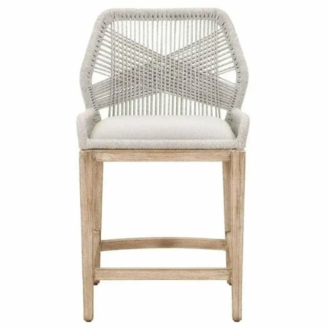 The Loom Counter Stool pairs coastal-inspired rope weaving with solid construction for everyday seating at kitchen islands...