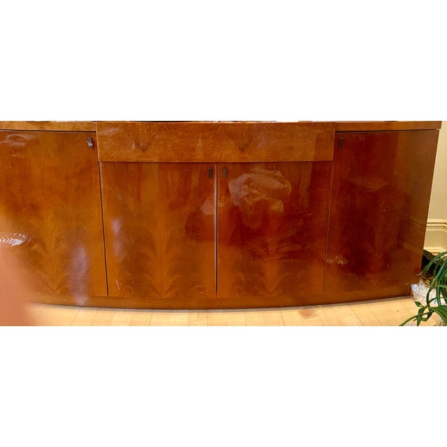 Italian Burlwood Buffet with Radiated Curved Front Design. 4 Doors and 1 center drawer..